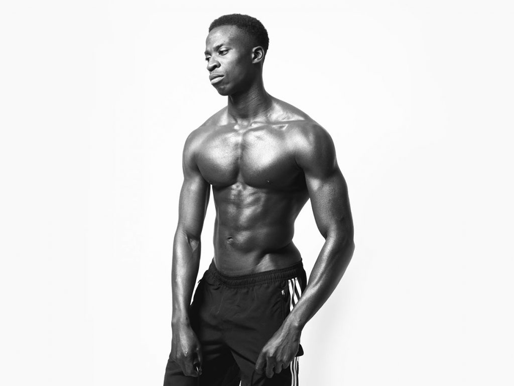 Shirtless black athlete.
