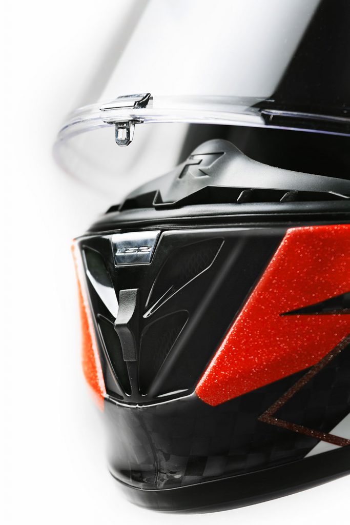 Close-up of red and black motorbike helmet.